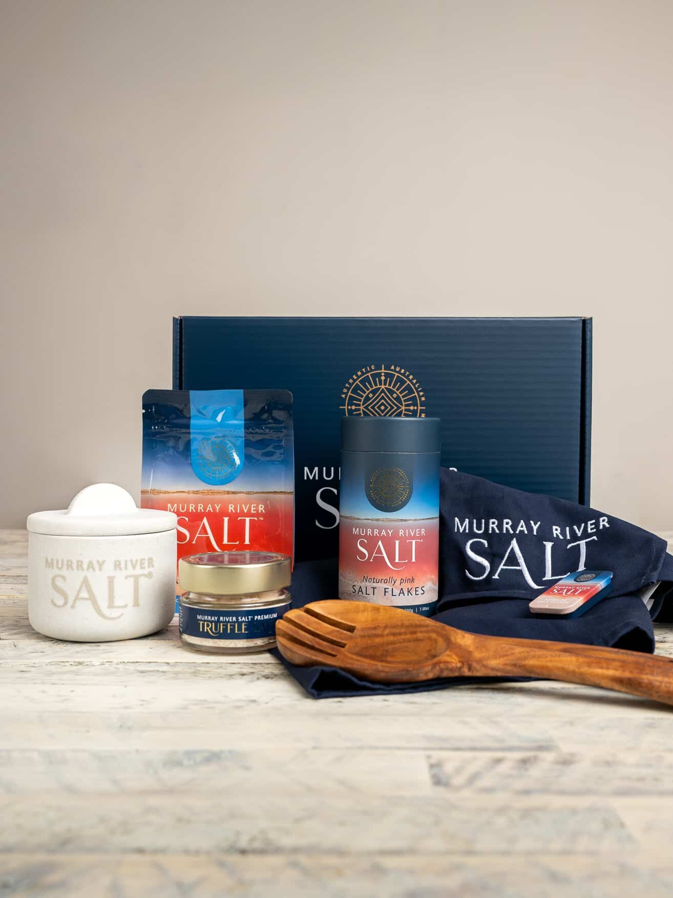 The full Murray River Salt product collection featuring a range of canisters, boxes, and pouches of premium pink salt flakes.