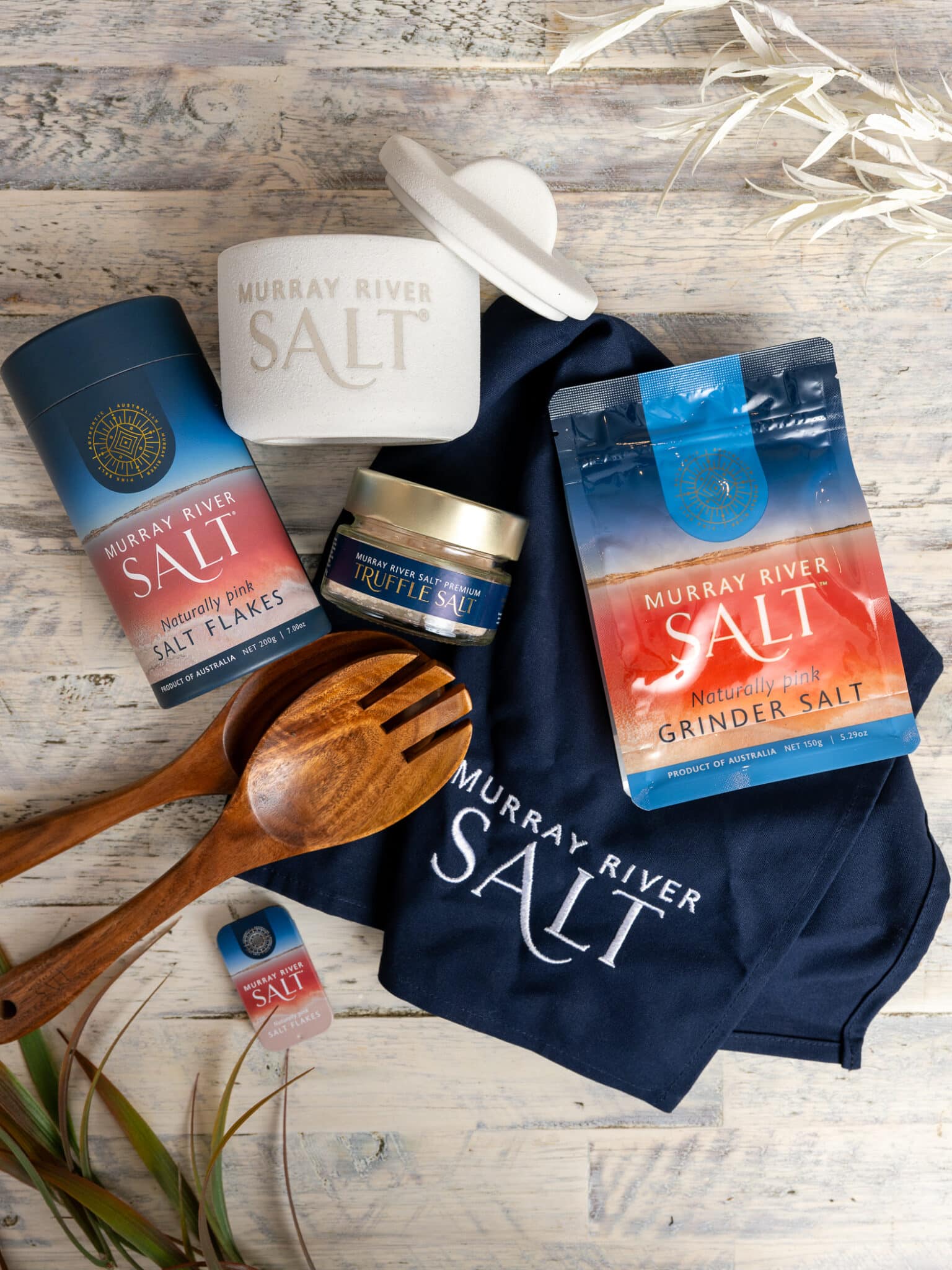 A complete lineup of the Murray River Salt collection featuring various packaging sizes and naturally pink salt flakes for gourmet use.